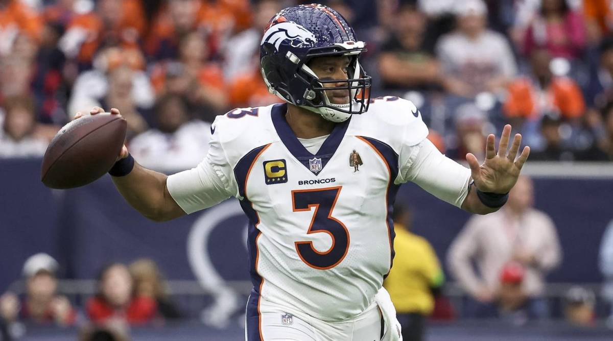 Broncos quarterback Russell Wilson throws a pass in a game.